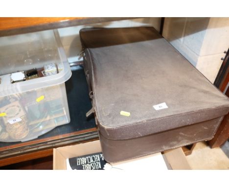 A case containing an Olympus camera, various books and sundries etc. 