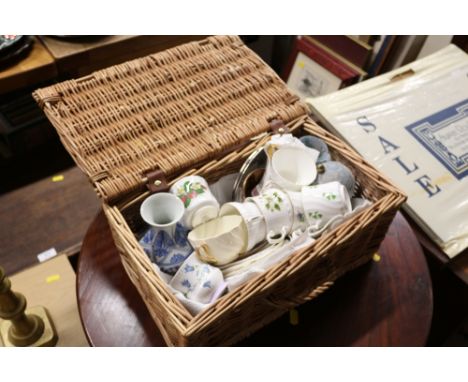 A Fortnum &amp; Mason wicker basket containing coffee cups and saucers etc. 