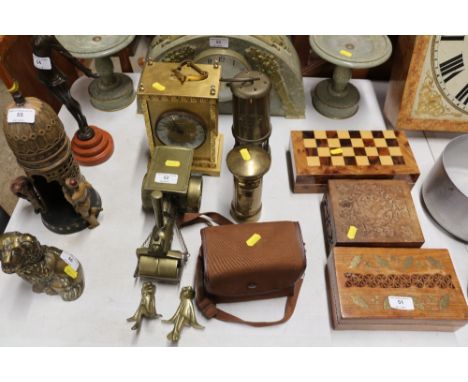 A brass cased mantel clock together with a miner's lamp; a box Brownie camera and other brass ornaments 