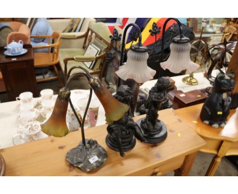 A pair of figural mounted table lamps and shades; and one other table lamp 