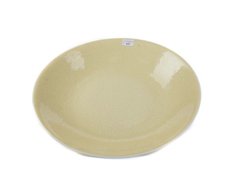 20TH CENTURY CHINESE CHARGER, with incised lotus scroll decoration on a yellow ground, four character mark to base, 47.5cm di