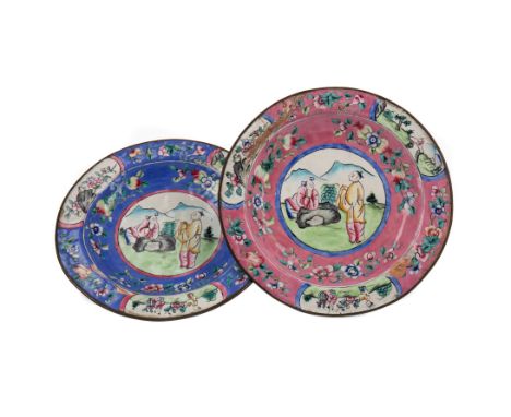 TWO 20TH CENTURY CHINESE ENAMEL CIRCULAR PLATES, painted with a central roundel of figures within borders of flowers, on blue