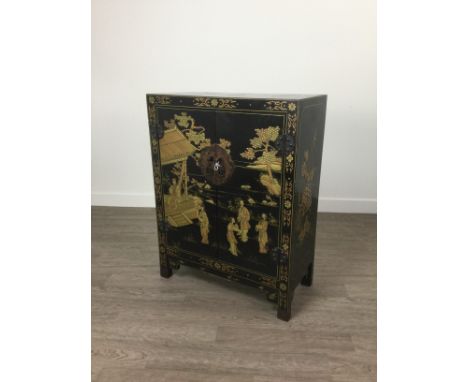 20TH CENTURY JAPANESE TWO DOOR CUPBOARD, with gilt lacquer decoration on black, the twin doors enclosing a single shelf, 59cm