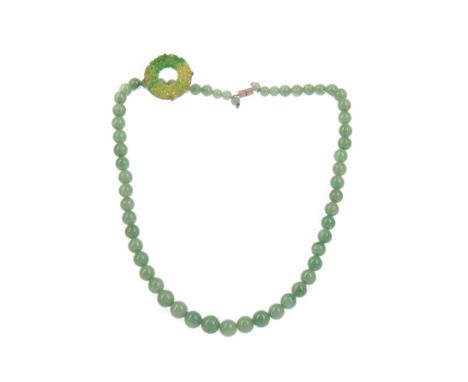 CHINESE JADE BEAD NECKLACE, formed with graduated beads, 25cm long (closed), along with a circular green hardstone brooch (pi