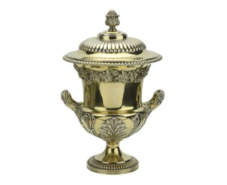 A fine silver gilt trophy cup and cover,  by Daniel and John Wellby, London 1927,   of campana form, the lobed domed cover wi