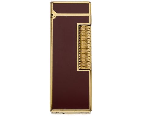 A red lacquer lighter by Dunhill, of rectangular form, signed ‘Dunhill’, numbered 24163, with case, pouch and papers, length 