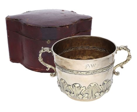 A James II silver gilt porringer,  by Timothy Ley, London 1686,    with twin S-scroll handles, the body decorated with emboss