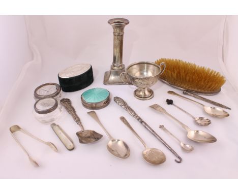 A quantity of silver items to include a candlestick, trophy cup, caddy spoon, salts etc