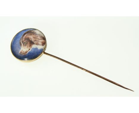 A Victorian stick pin with a miniature of a Spaniel

CONDITION REPORT - Pin & frame round glass tests gold but reverse appear