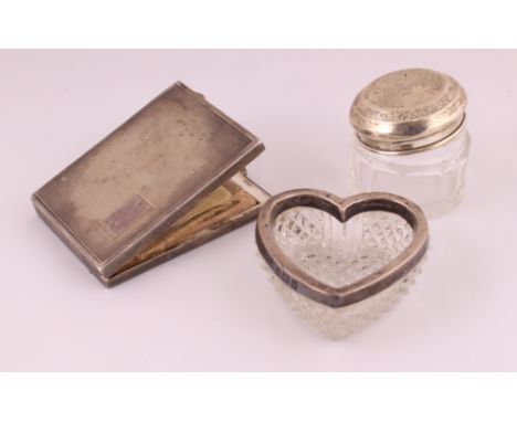 A silver rectangle powder compact H/M Birmingham 1945, together with a small silver topped jar & a heart shaped silver rimmed