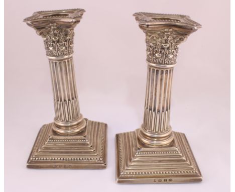 A pair of Victorian silver corinthian column candlesticks with detachable sconces, 6" high & H/M Birmingham 1899, some faults