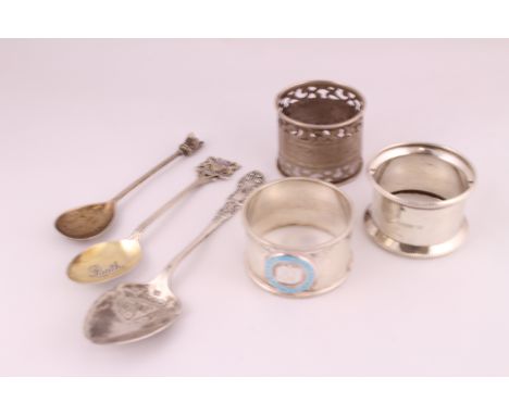 Three silver H/M napkin rings together with three decorative spoons, together approx weight 114gms