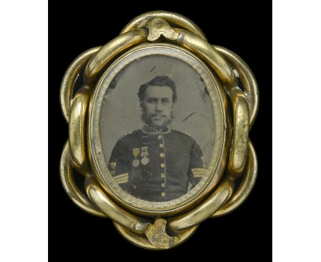 An Ambrotype of a Sergeant wearing the Crimea and Turkish Crimea Medals. Mounted (probably in memorium) in a swivel gilt broo