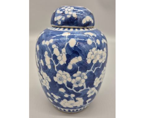 Late 19th century Chinese Qing dynasty Kangxi Nian Zhi period marked Blue and white blossom design jar and lid. [19cm high] 
