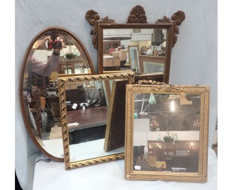 A WALL MIRROR WITH CARVED DECORATION and three others