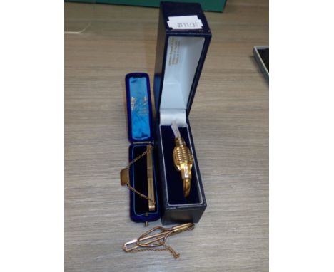 A YELLOW METAL BANGLE/WATCH and two similar tie pins