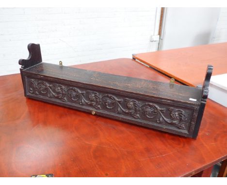 A VICTORIAN CARVED OAK WALL HUNG SHELF with single door and fitted interior, 91.5cm wide