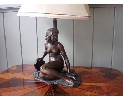 A BRONZED SPELTER FIGURAL LAMP a nude woman with a tambourine 27 cm high, plus fitting (small piece broken from base)