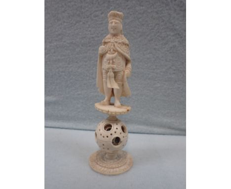 A CHINESE EXPORT FIGURAL CHESS PIECE probably a portrait of George III, on a puzzle-ball, 19th century 13.5 cm high