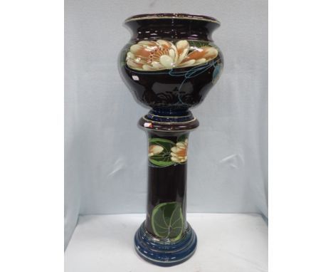 AN EDWARDIAN ART NOUVEAU JARDINIERE AND STAND signed, 'R Dean', 84cm high (overall)