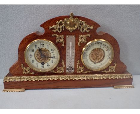 A LATE VICTORIAN CLOCK/BAROMETER/THERMOMETER in oak case with cast brass mounts 40 cm wide (re-finished)