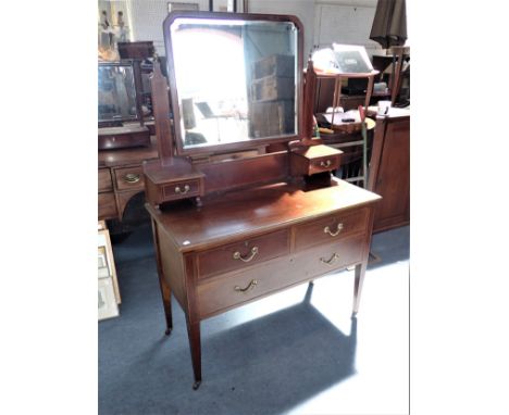 AN EDWARDIAN MAHOGANY LINE INLAID DRESSING TABLE with bevel edged mirror (note woodworm)