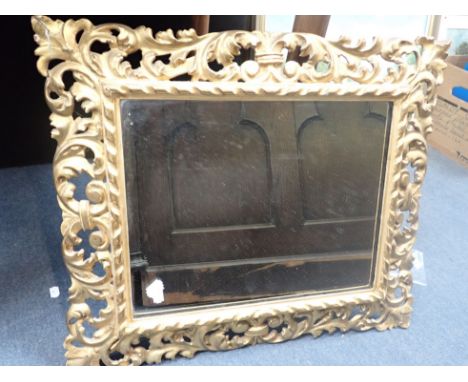 A FLORENTINE CARVED GILTWOOD MIRROR 48 x 57 cm (chips, cracks)