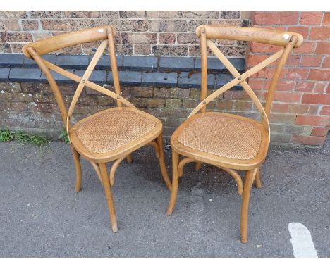 A PAIR OF 'OKA' CONTINENTAL STYLE LIGHT OAK 'CAFE' CHAIRS 