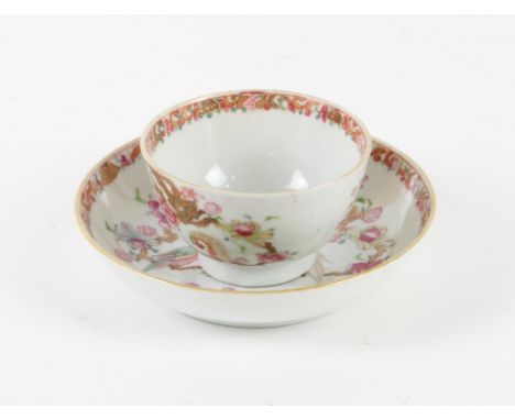 A Famille Rose and Gilt Cup and Saucer, Yongzheng-Qianlong periodFinely painted, with parrots perched on branches and flowers