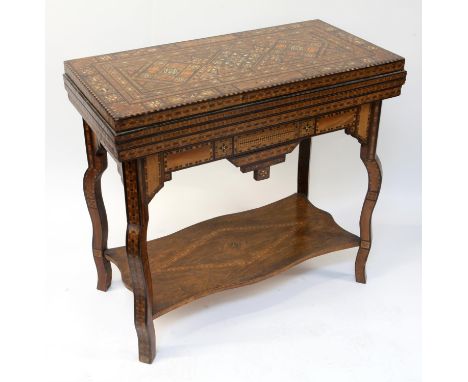 An Inlaid Syrian Damascus Gaming Table , Circa 1880-1910 Inlaid overall with various wood , mother of pearl and bone forming 