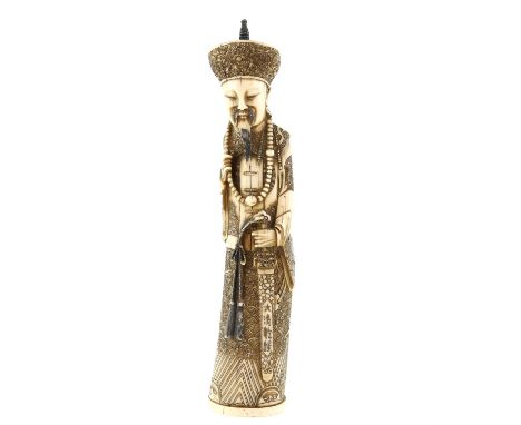 A Chinese Ivory Statue of a dignitary , Late Qing dynasty , Early Republic, decorated with black stained engraving and repres