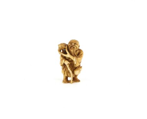 A Japanese Netsuke , Meiji Period Circa 1880 Carved Ivory in shape of a man with a frog, Signed . 5.6 X 3.2 cm Comes with a D