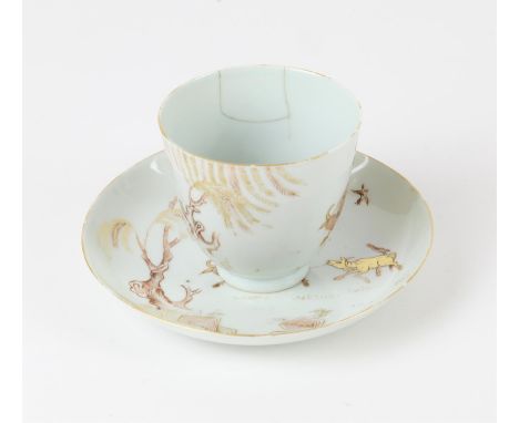 A Chinese Iron Red and Gilt Cup and Saucer , Kangxi-Yongzheng period, Painted with a boy riding a buffalo in a landscape with