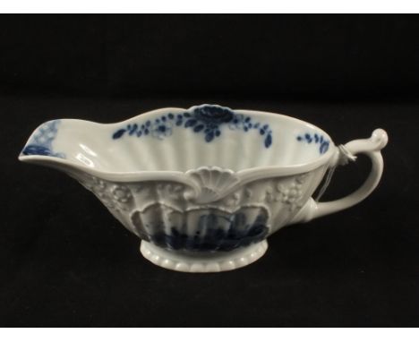 A Worcester style blue and white sauce boat with moulded decoration