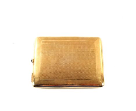 A 9ct Gold engine turned cigarette case 132.8grams, clasp set with Cabochon stone