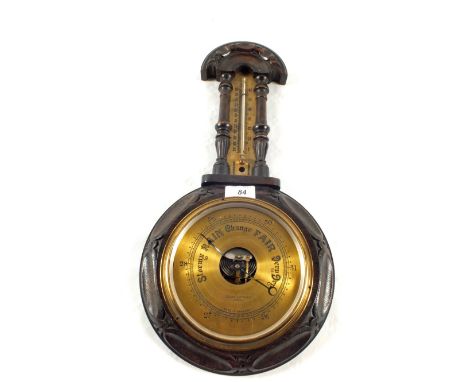 A carved Oak Brass dial barometer (no glass)
