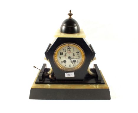 A Black Marble and Onyx striking mantel clock
