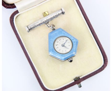 A 20th century Swiss guilloche enamel watch or pendant, the circular dial with Arabic numerals set to a irregular hexagonal s
