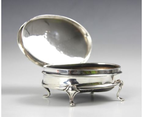 A George V silver jewellery box, Lee and Wigfull, Sheffield 1918, the shaped rim with domed hinged cover opening to reveal bl