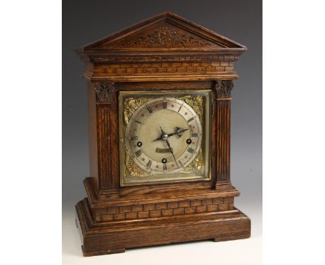 A German oak cased bracket clock, by Winterhalder and Hoffmeier, late 19th/early 20th century, the architectural case with fl