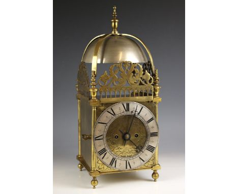 A brass cased eight day twin fusee lantern form clock, late 19th century, the substantial overhead bell above openwork frets 