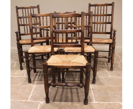 An 18th century oak drop leaf dining table, the oval top upon bobbin turned supports united by plain cross stretchers, 74cm H