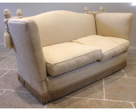 A Knoll sofa, mid 20th century, in straw coloured fern pattern fabric, the camel back extending to twin drop ends retained by