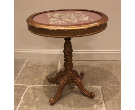 A French Louis XVI style giltwood and gesso pedestal occasional table, late 18th/early 19th century, the oval glazed top inse