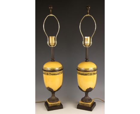 A pair of Theodore Alexander lamp bases, each of shouldered ovoid form with brass band, decorated with foliate swags between 