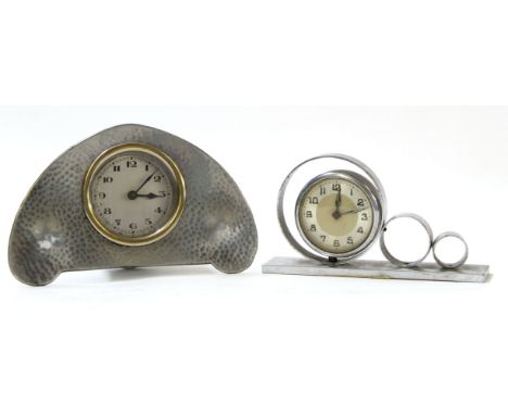 Liberty style alarm clock with hammered pewter surround, the reverse marked "L &amp; Co Homeland No 516", 14cm long, together