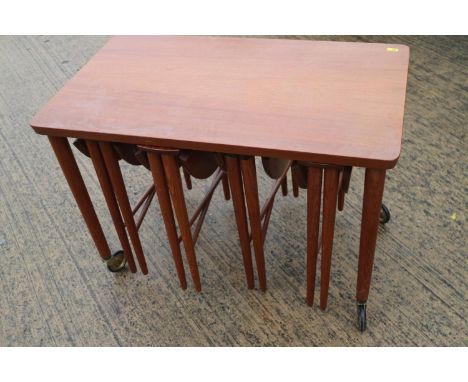 A set of five teak occasional tables, four circular drop leaf and one rectangular table, 29" wide x 17" deep x 19" high 