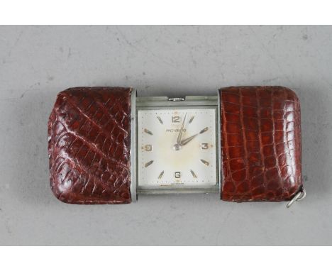 A brown leather clad Movado purse watch with silvered dial and baton and Arabic numerals 