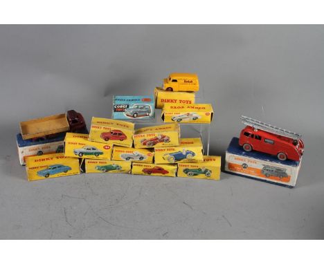 A collection of Dinky and other die-cast vehicles, including 555 fire engine, 522 Big Bedford lorry, 133 Cunningham C-SR Road