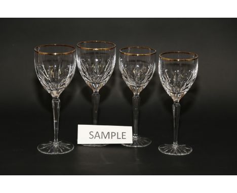 A Gorham cut and gilt glass part table service of twenty-three white and sixteen red wine glasses, on star cut bases 